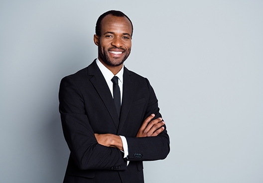man standing with his arms crossed