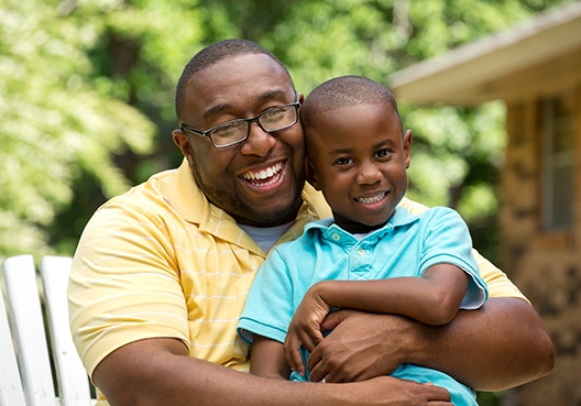 dad hugging son