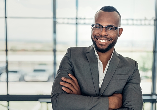 man standing with his arms crossed